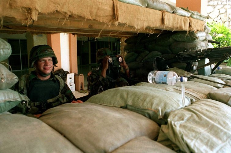 soldiers-from-the-10th-mountain-division-light-infantry-stand-behind-a-sandbag-e696cd-1024.jpg